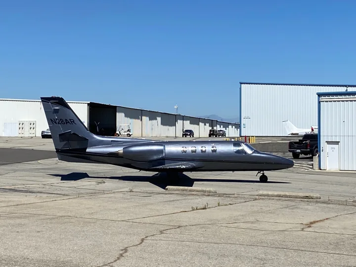Dark metallic business jet in the Corona Air Paint gallery