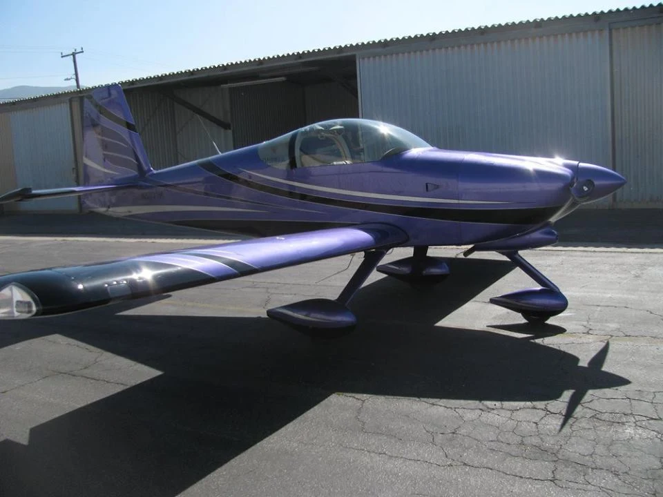 Custom purple and silver paint scheme on piston aircraft